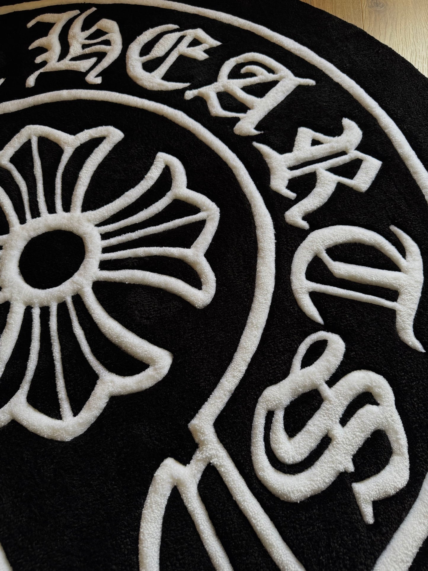 Chrome Hearts-inspired tufted rug featuring bold gothic cross design — a statement collectible for streetwear enthusiasts and luxury interiors