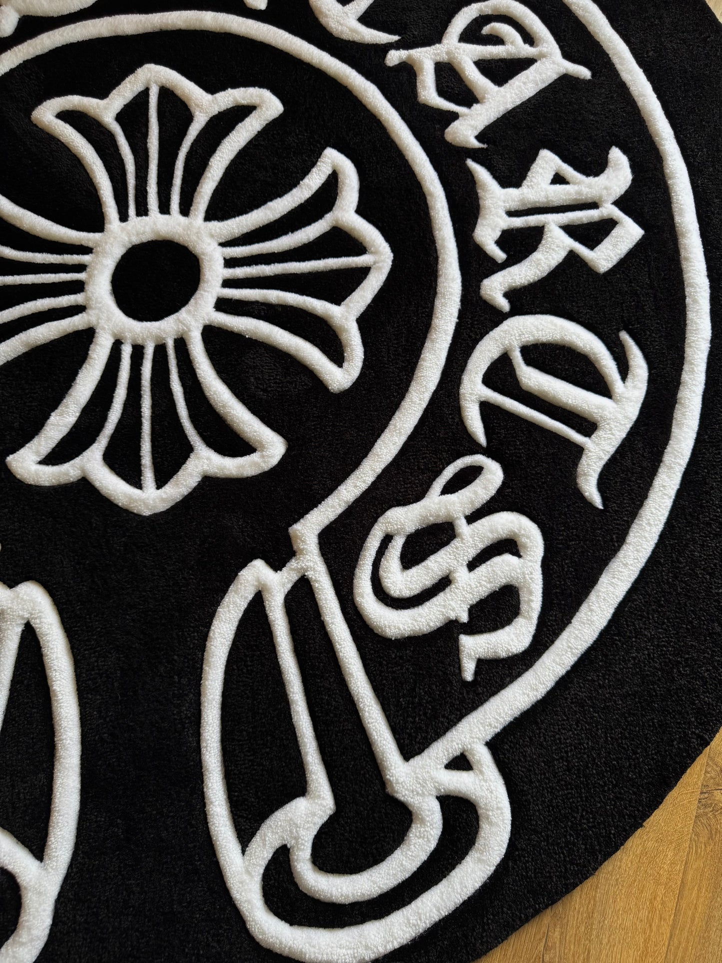 Chrome Hearts-inspired tufted rug featuring bold gothic cross design — a statement collectible for streetwear enthusiasts and luxury interiors