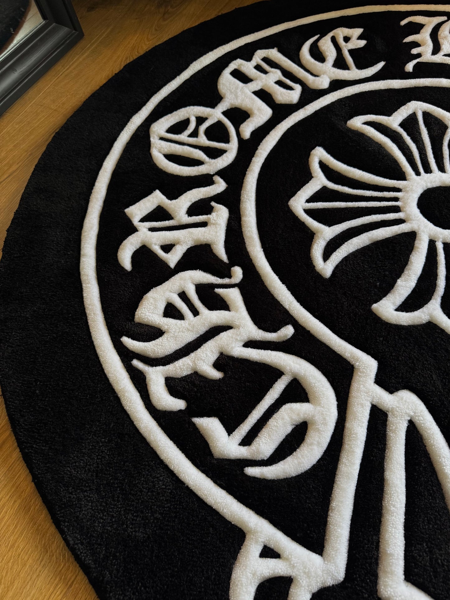 Chrome Hearts-inspired tufted rug featuring bold gothic cross design — a statement collectible for streetwear enthusiasts and luxury interiors