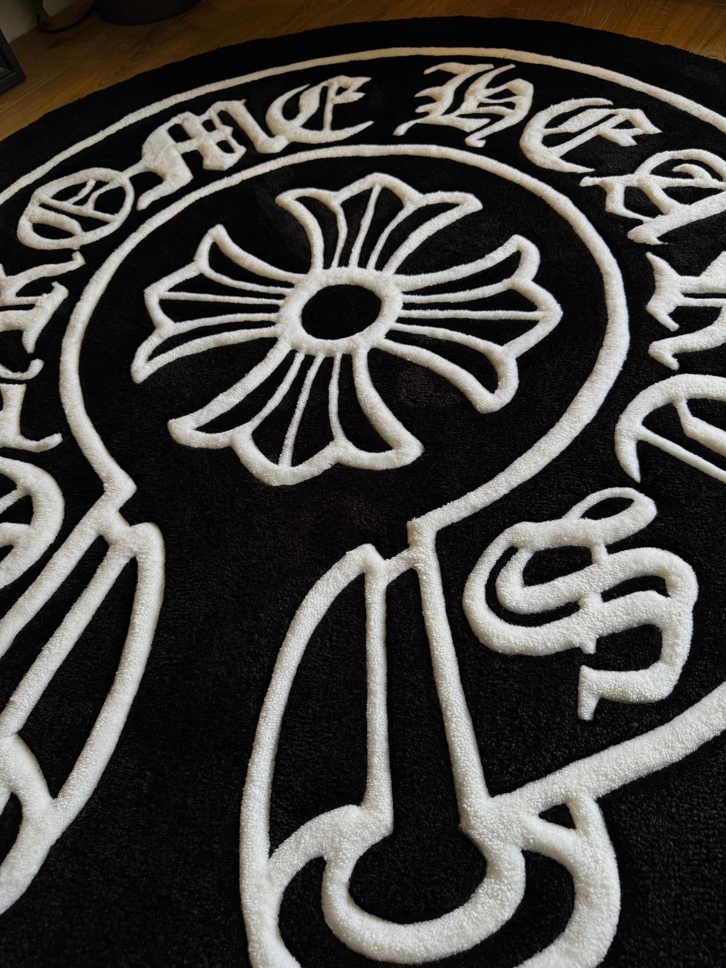 Chrome Hearts-inspired tufted rug featuring bold gothic cross design — a statement collectible for streetwear enthusiasts and luxury interiors