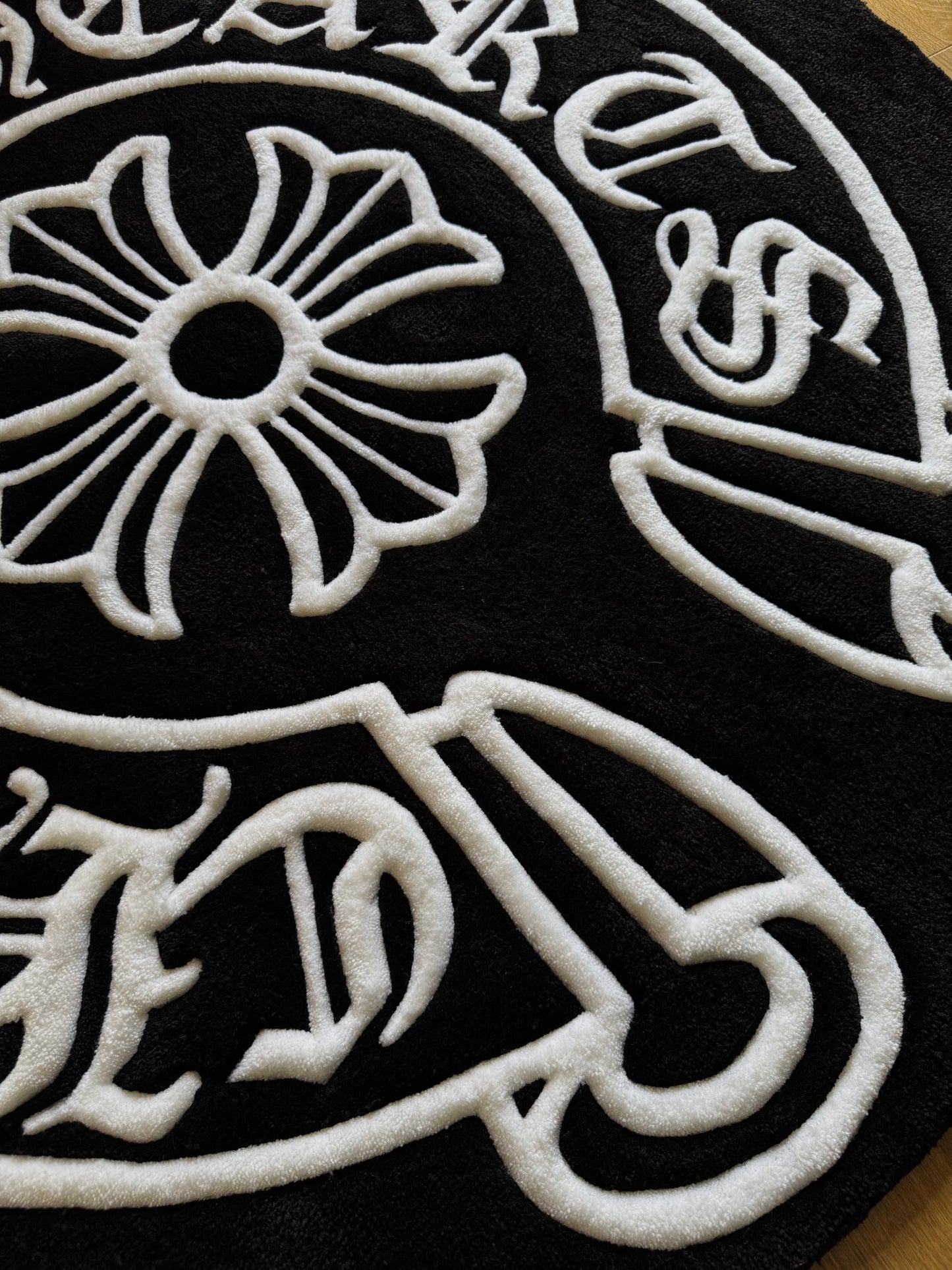 Chrome Hearts-inspired tufted rug featuring bold gothic cross design — a statement collectible for streetwear enthusiasts and luxury interiors