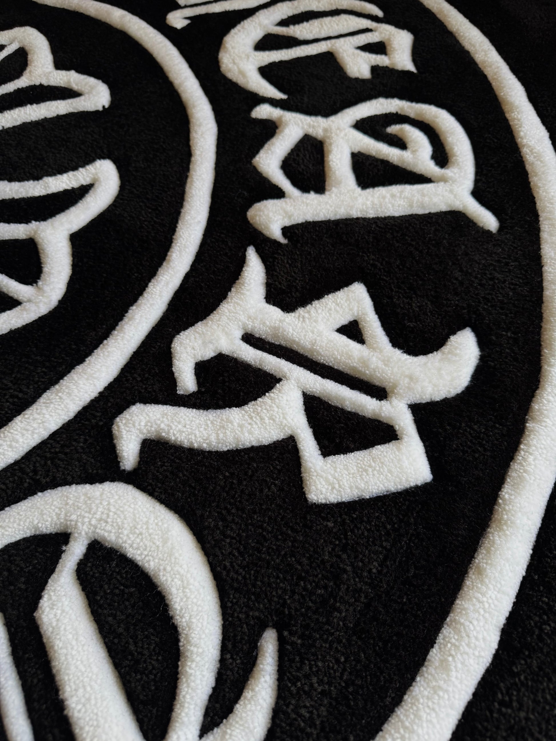 Chrome Hearts-inspired tufted rug featuring bold gothic cross design — a statement collectible for streetwear enthusiasts and luxury interiors